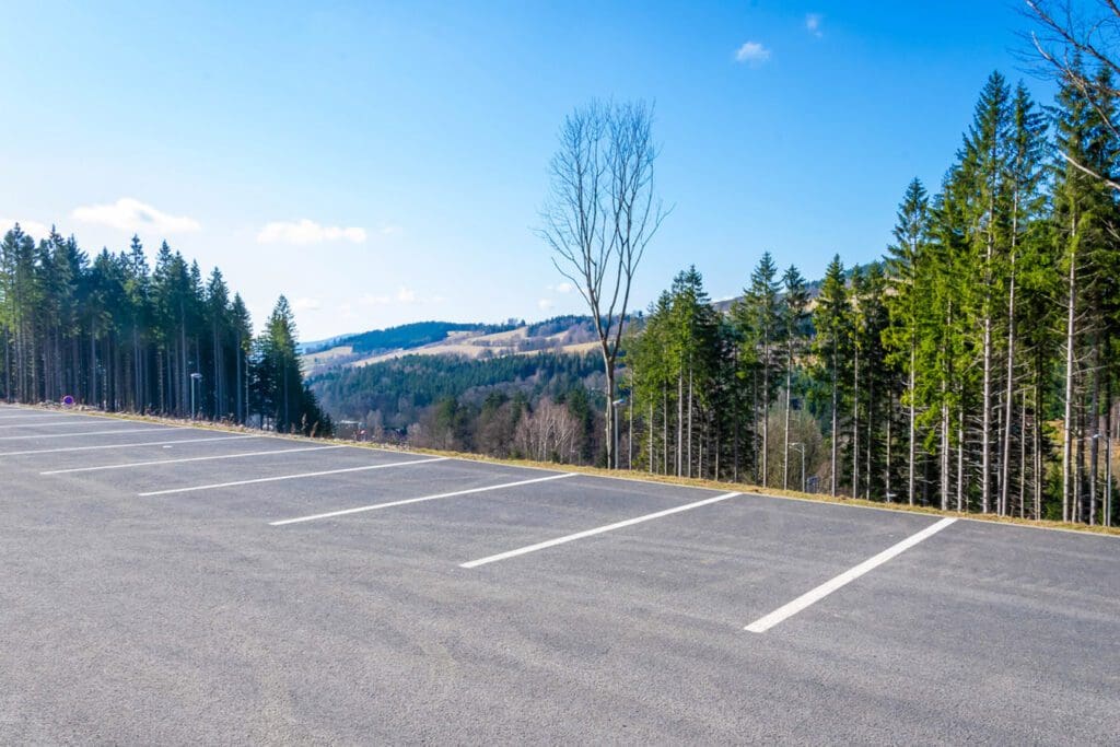 Car parking lot with Black Hills and pine trees in the background